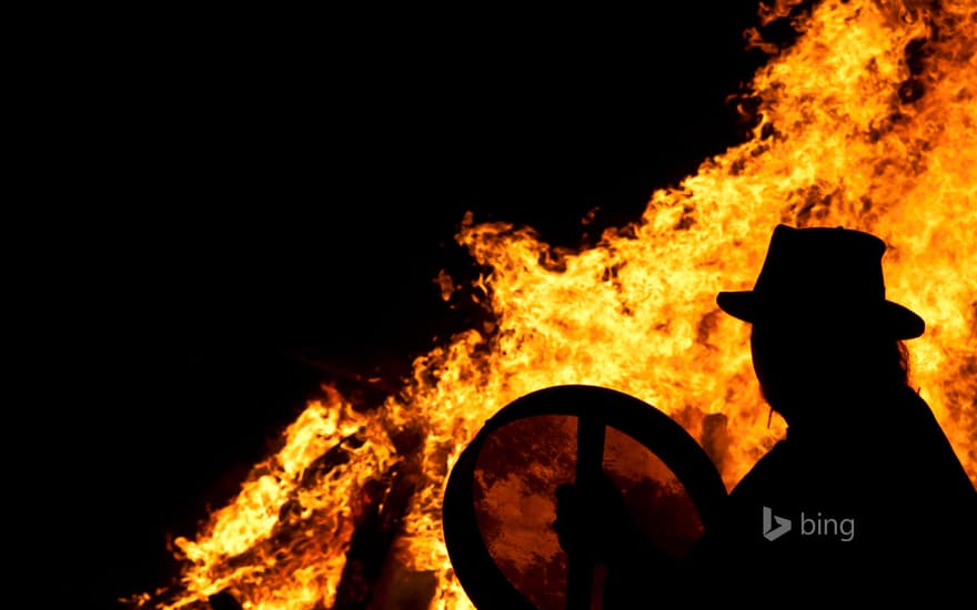 Drummer with a bodhran at a pagan Beltane fire ceremony