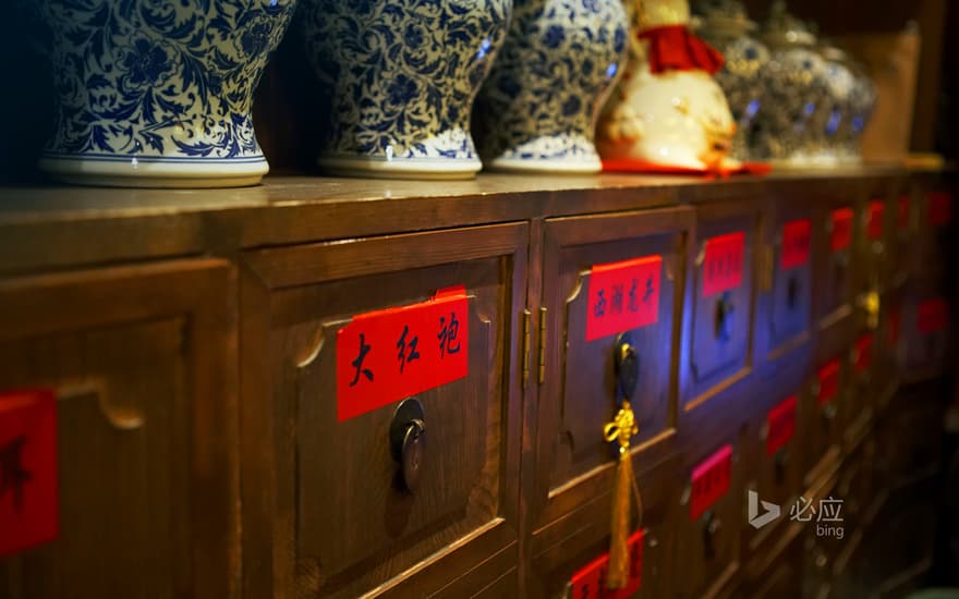 A row of bottles on the cabinet